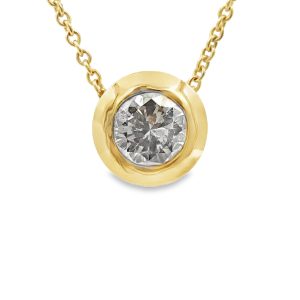 Diamond solitaire necklace featuring a 1.50cts bezel-set diamond in 14K gold.